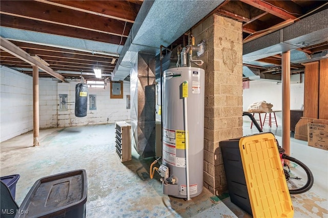 basement with gas water heater, heating unit, and electric panel