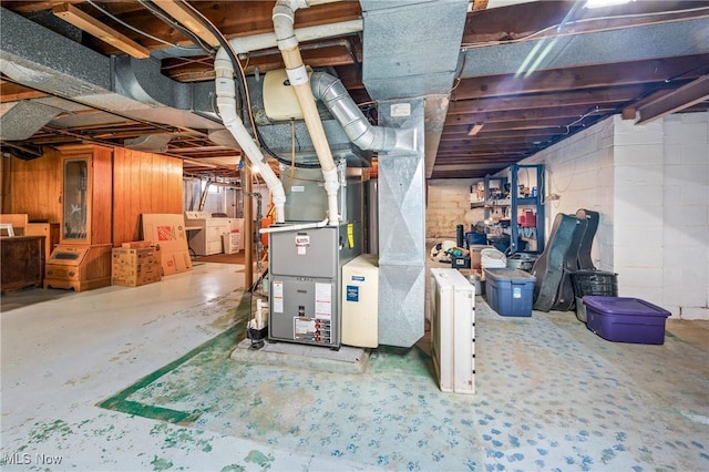 basement featuring washer / clothes dryer and heating unit