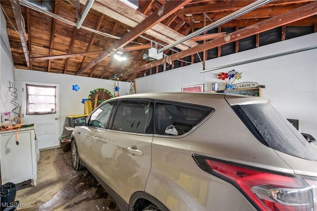 garage featuring a garage door opener