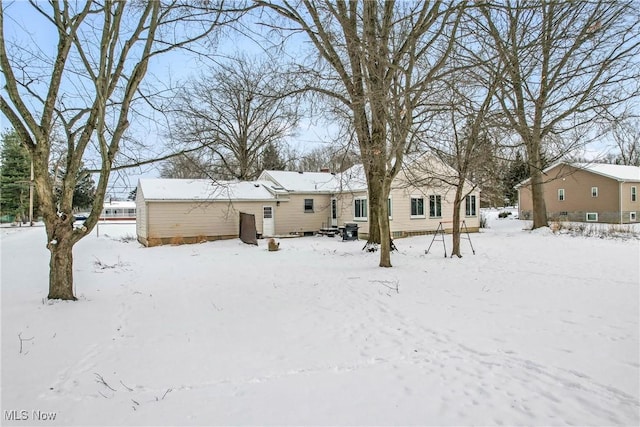 view of snow covered house