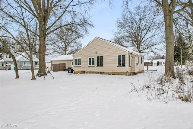 view of snow covered house