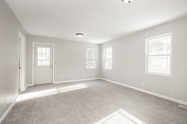 empty room with carpet flooring