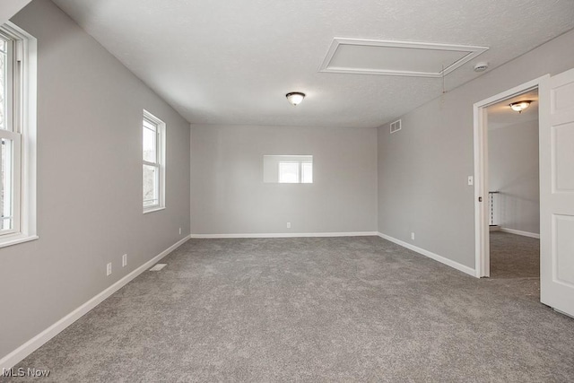 unfurnished room with carpet floors