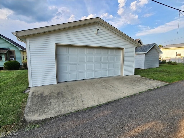 garage featuring a yard