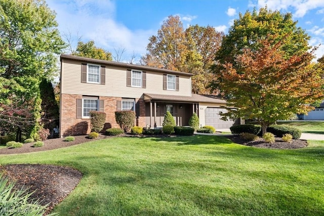 view of front of home featuring a garage and a front yard