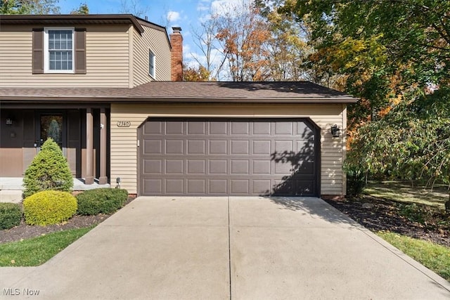 view of front of property with a garage