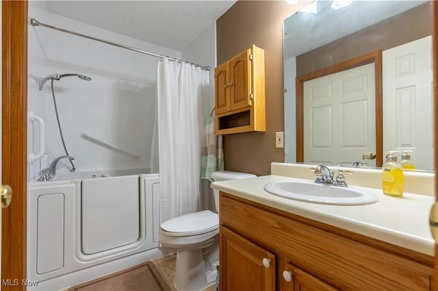 full bathroom featuring toilet, shower / bath combination with curtain, and vanity