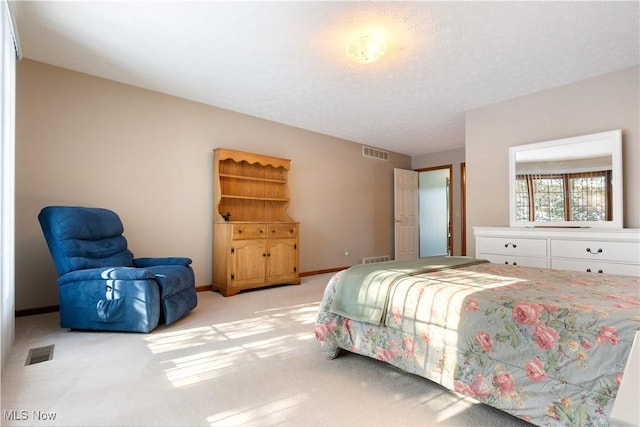 bedroom featuring light carpet