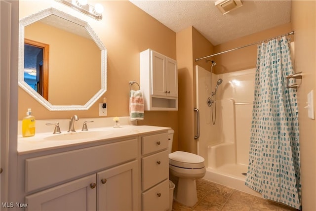 bathroom with toilet, a textured ceiling, tile patterned floors, vanity, and a shower with curtain