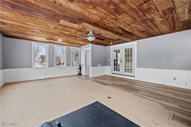 interior space with wood-type flooring, french doors, ceiling fan, and wood ceiling