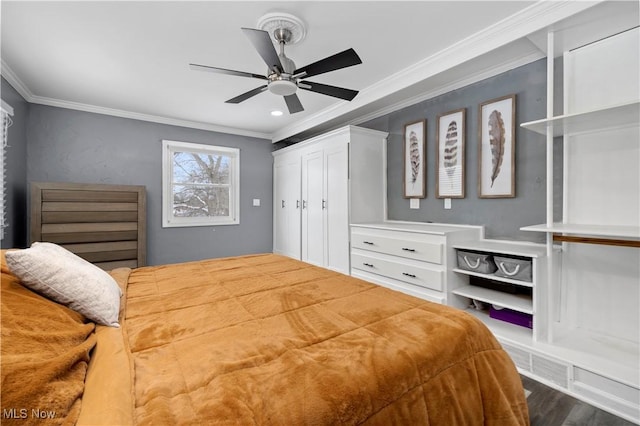 bedroom featuring ceiling fan, crown molding, and dark hardwood / wood-style flooring