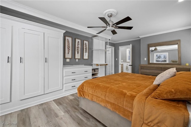 bedroom featuring light hardwood / wood-style flooring, ceiling fan, and ornamental molding