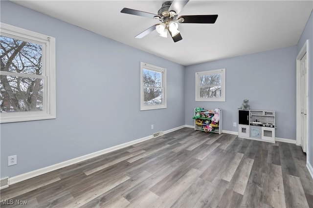 rec room featuring hardwood / wood-style floors and ceiling fan