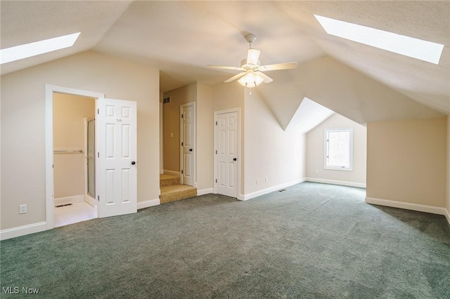 bonus room featuring ceiling fan, vaulted ceiling, and carpet