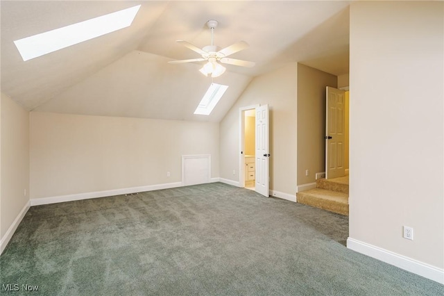 additional living space featuring ceiling fan, carpet, and vaulted ceiling