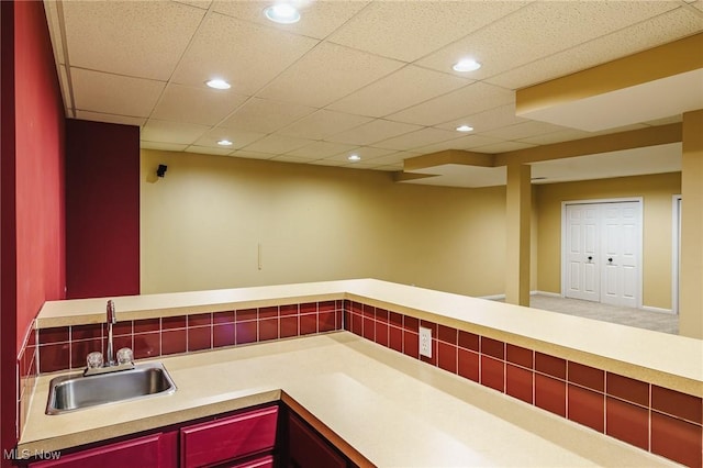 kitchen with sink and a drop ceiling