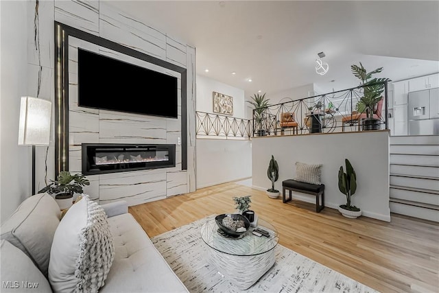 living room featuring hardwood / wood-style floors and a fireplace