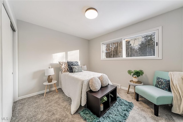 bedroom with carpet floors and a closet