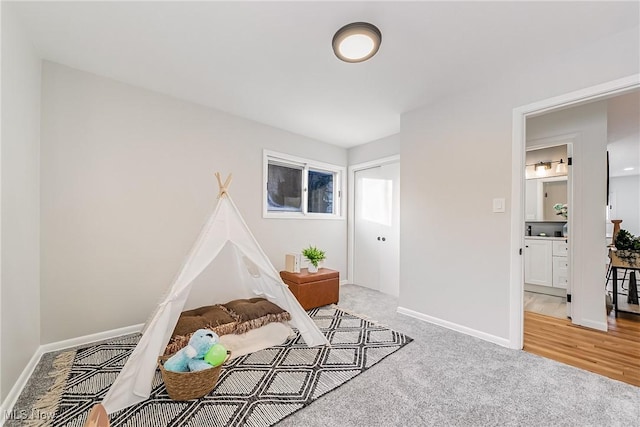 playroom featuring light carpet