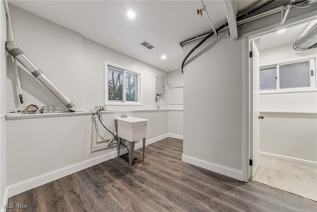 basement with dark wood-type flooring