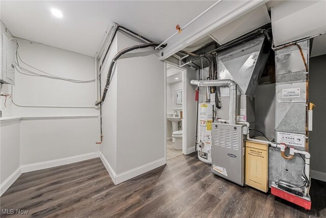 utility room featuring gas water heater