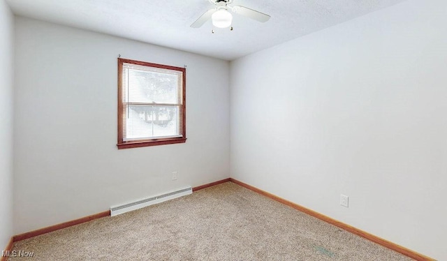 carpeted empty room featuring a baseboard radiator and ceiling fan