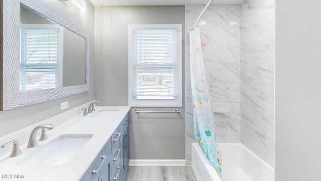 bathroom with vanity, hardwood / wood-style flooring, and shower / bath combination with curtain