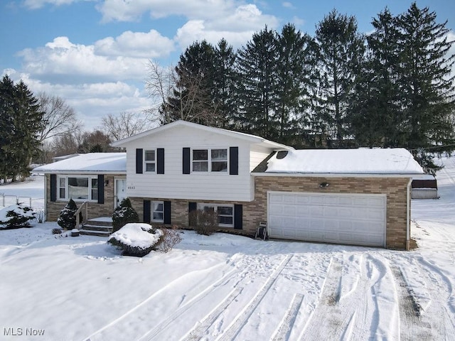 split level home featuring a garage