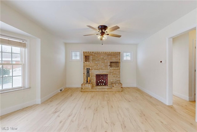 unfurnished living room featuring light wood-type flooring and ceiling fan