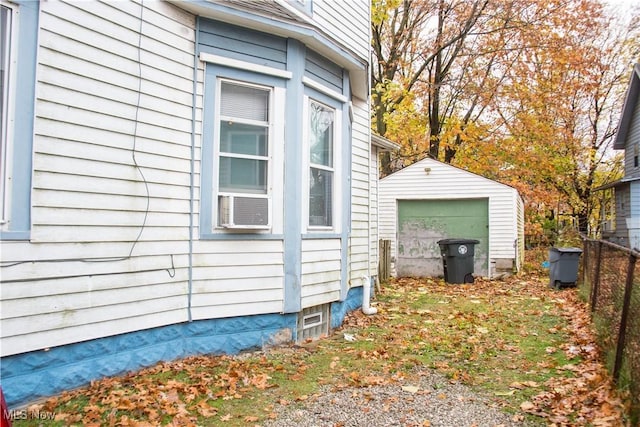 view of property exterior with a garage and an outbuilding