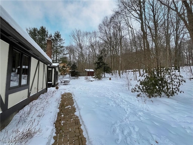 view of yard covered in snow