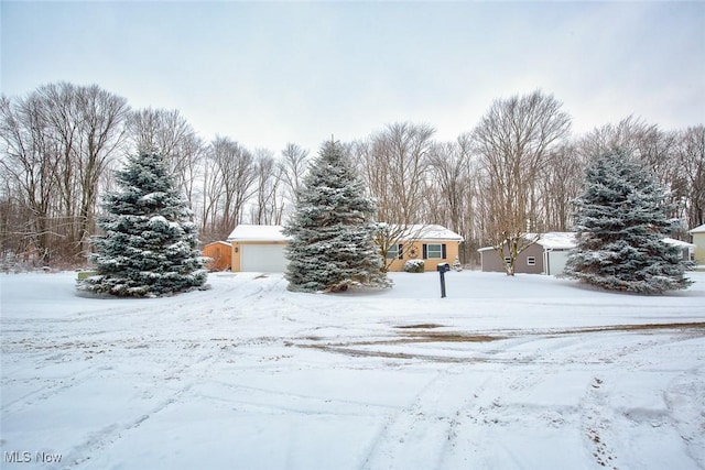 view of yard layered in snow