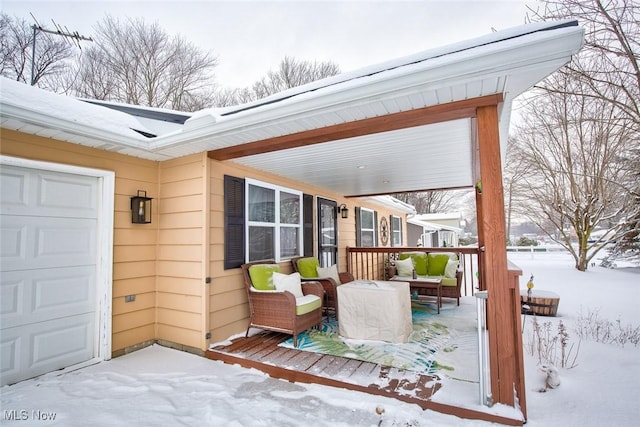 view of snow covered deck