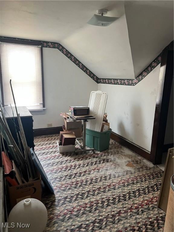 living area featuring vaulted ceiling