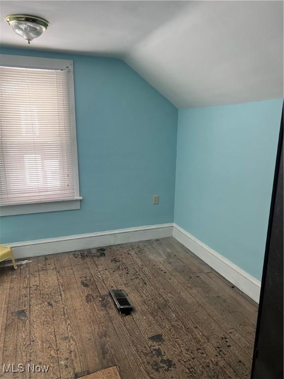 bonus room featuring hardwood / wood-style floors and lofted ceiling