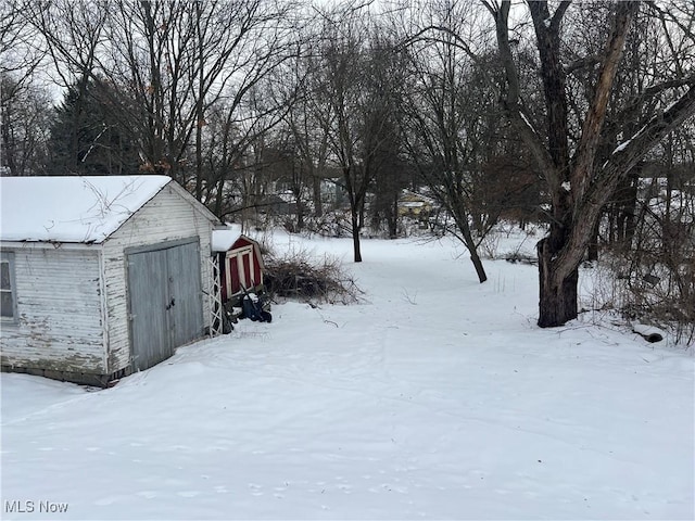 view of yard covered in snow