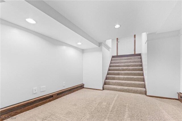 basement featuring carpet flooring