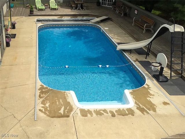 view of pool featuring a wooden deck