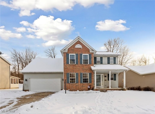 view of front of house featuring covered porch and a garage