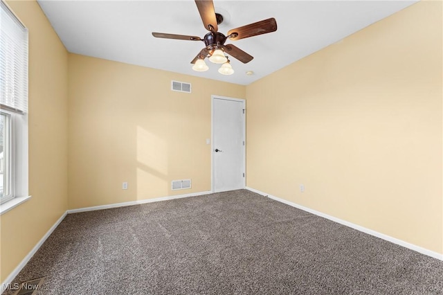 carpeted empty room with ceiling fan