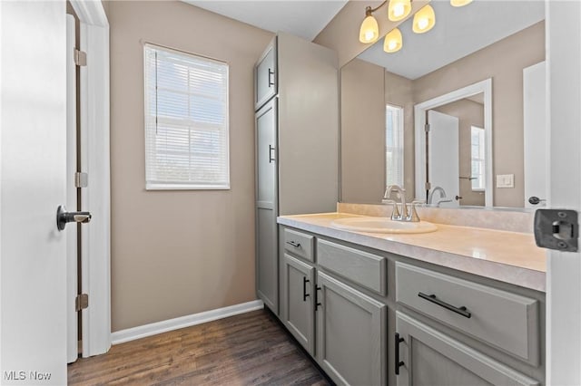 bathroom with vanity and hardwood / wood-style floors