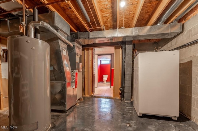 interior space featuring water heater, heating unit, and white fridge