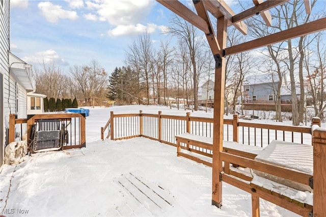 view of snow covered deck