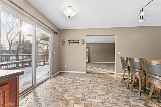 dining area with track lighting