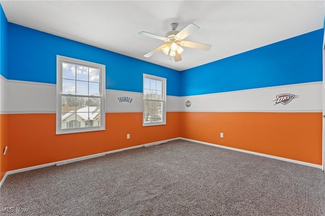 carpeted empty room with ceiling fan