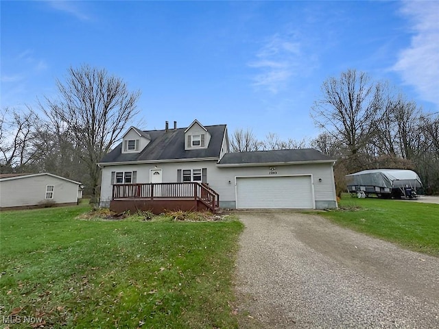 new england style home with a garage and a front yard