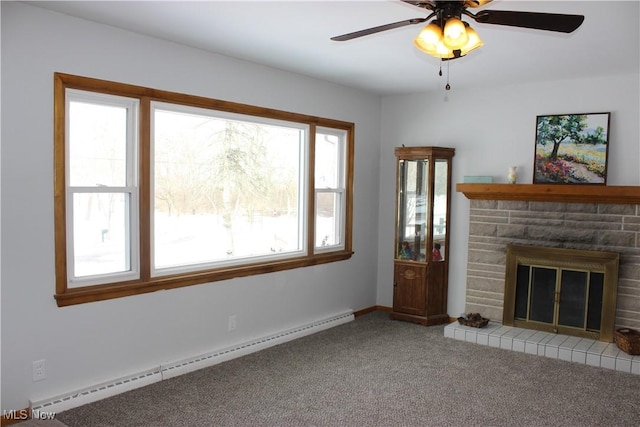 unfurnished living room with baseboards, ceiling fan, carpet, baseboard heating, and a stone fireplace