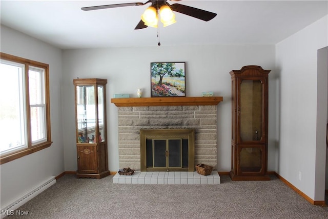 unfurnished living room featuring a baseboard radiator, baseboards, a stone fireplace, and light colored carpet