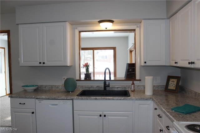 kitchen featuring white cabinets, dishwasher, range, and sink