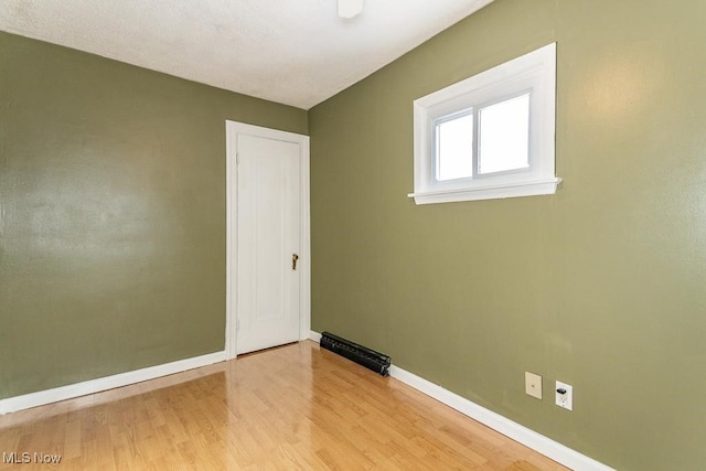 empty room with light hardwood / wood-style floors